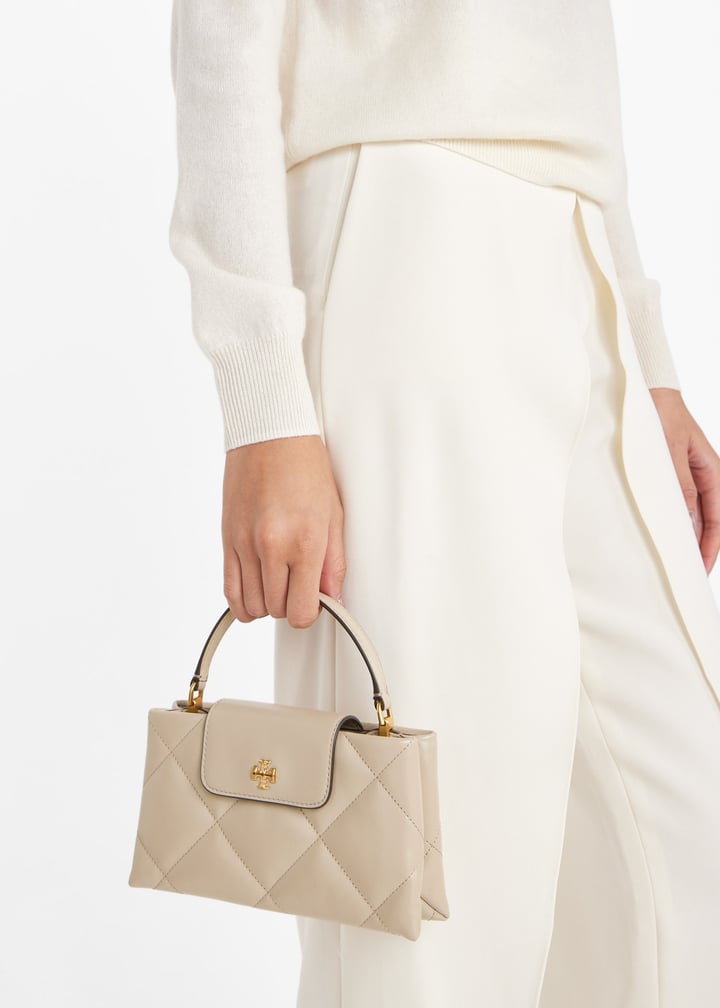 Kira diamond quilt East West top handle bag